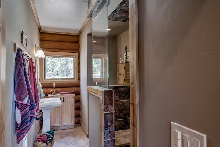 Bathroom with a steam shower and wood accents